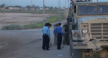Iraqi Police with downed truck